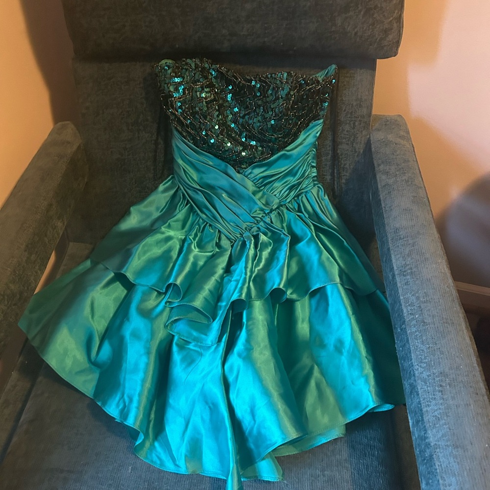 Blue Graphic T-Shirt /Teal satin strapless dress with black sequin detail .